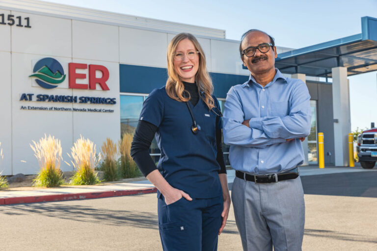 Valerian poses in front of the ER at Spanish Springs with a medical professional