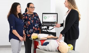 An instructor teaching students CPR
