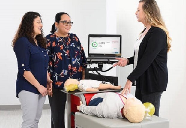 An instructor teaching students CPR
